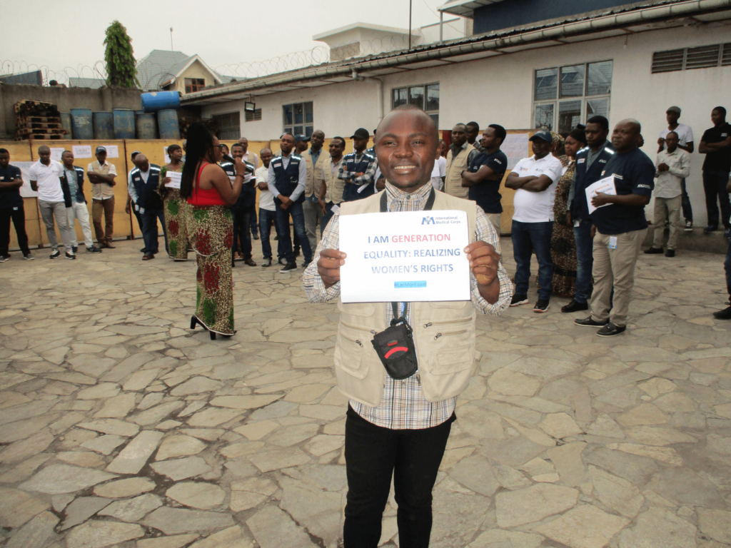 Mussa holds up a sign of support during an International Women’s Day event in Goma, North Kivu province.