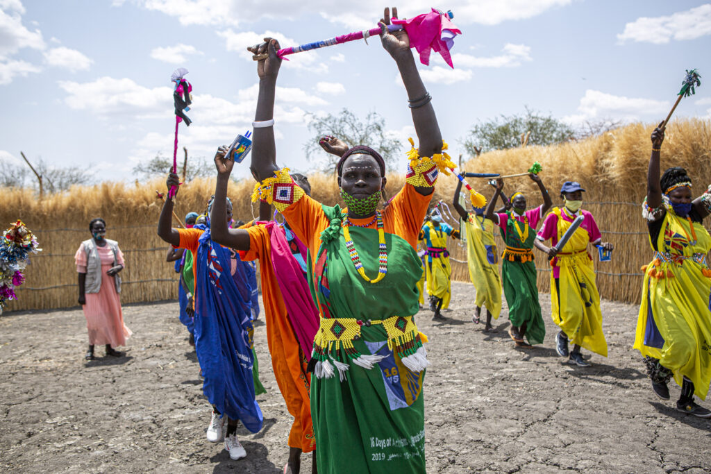 Women dance at a Women and Girls Friendly Space in Aburoch, South Sudan, on March, 18, 2021. International Medical Corps trains women in different activities such as sewing or beading as well as basic literacy and GBV awareness.