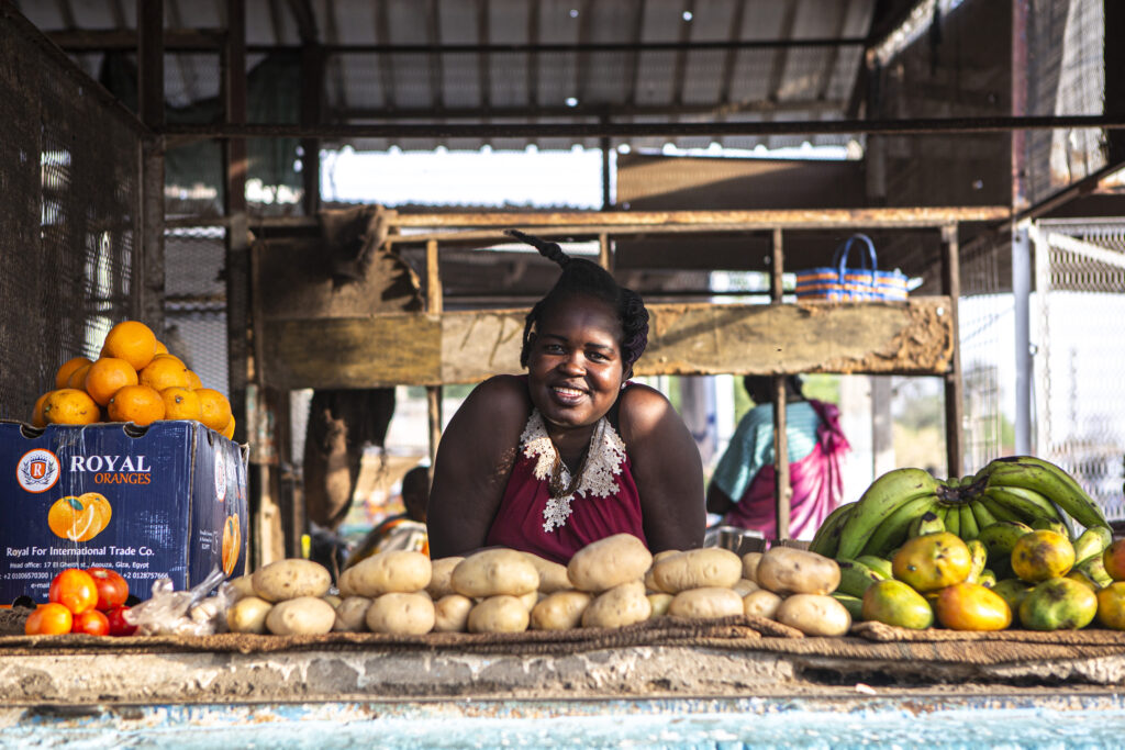 Ayak Andrew, 28, poses for a portrait at her food stand in Malakal, South Sudan, on March 19, 2021.