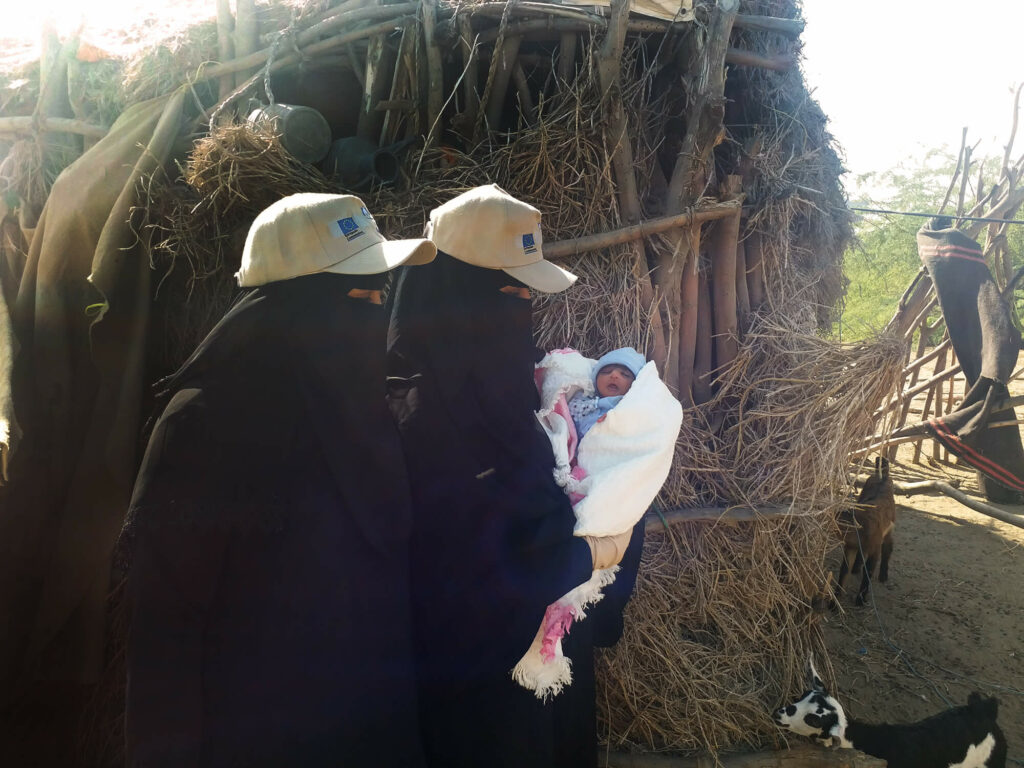 Members of our mobile medical team at a displacement camp 20 miles from Al-Mukha examine an infant with breathing difficulties. Our team leader, Dr. Gubran Al-Sufi, recommended referring the child to Al-Mukha Hospital for care that saved the child’s life.