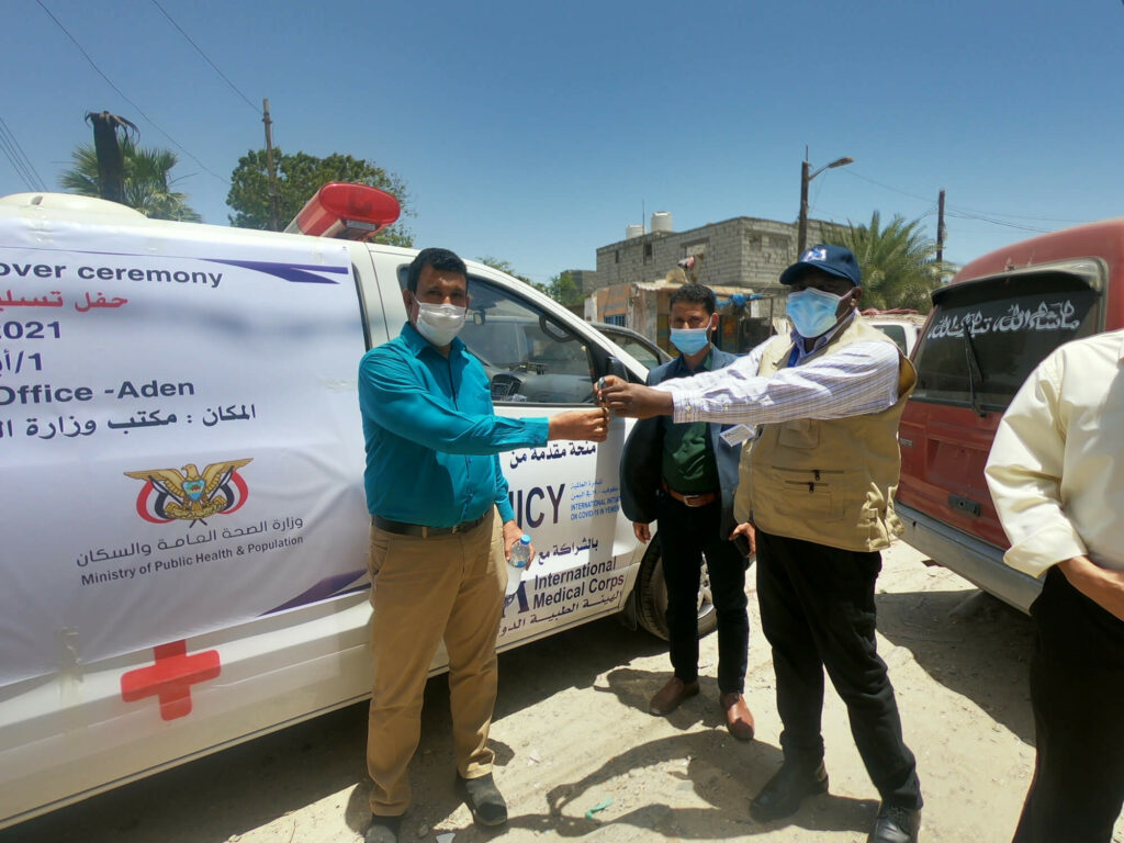 International Medical Corps presents the keys for a new ambulance to the administrator of Al-Mukha Hospital. The vehicle will strengthen the area’s patient-referral system.