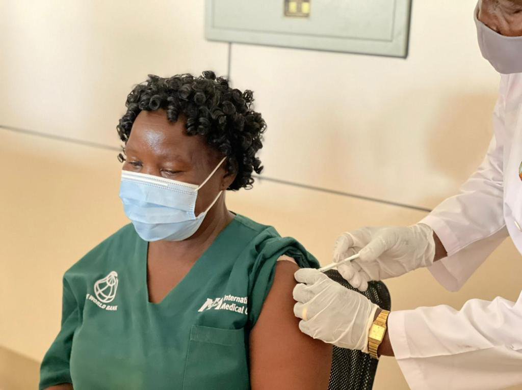 A healthcare worker in Juba, South Sudan, receives the COVID-19 vaccine.