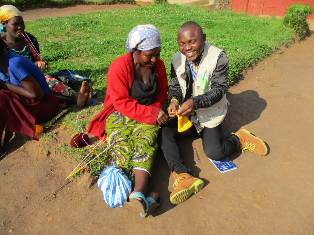 Mussa learning how to knit in North Kivu Province.