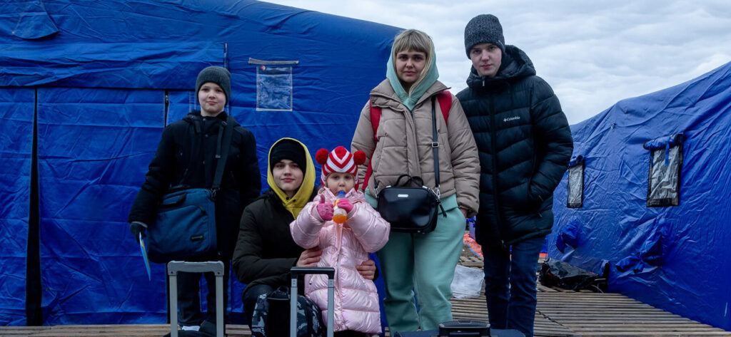 38-year-old Olga poses for a photo with two of her children and two nephews next to the luggage with which they arrived from the Ukrainian city of Vinnytsia. Olga has also been traveling with her parents, who preferred not to pose for the photo on March 06, 2022 in Siret, Romania.