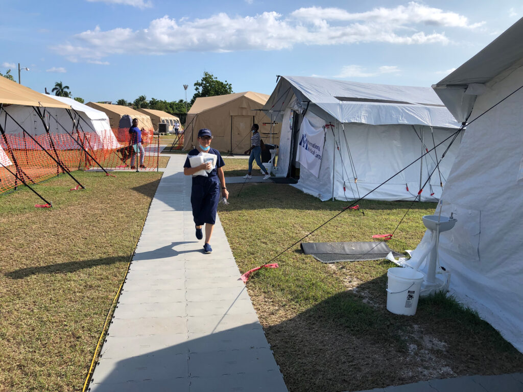 A member of International Medical Corps’ team walks through the EMT in Haiti.