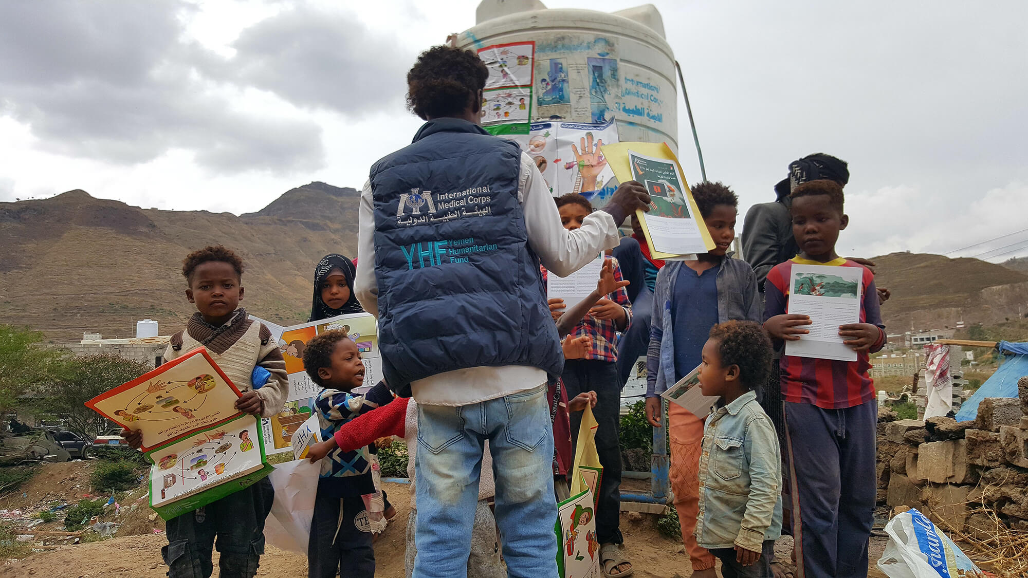 Basheer educates children in Authority Road IDP Camp on the importance of good hygiene.