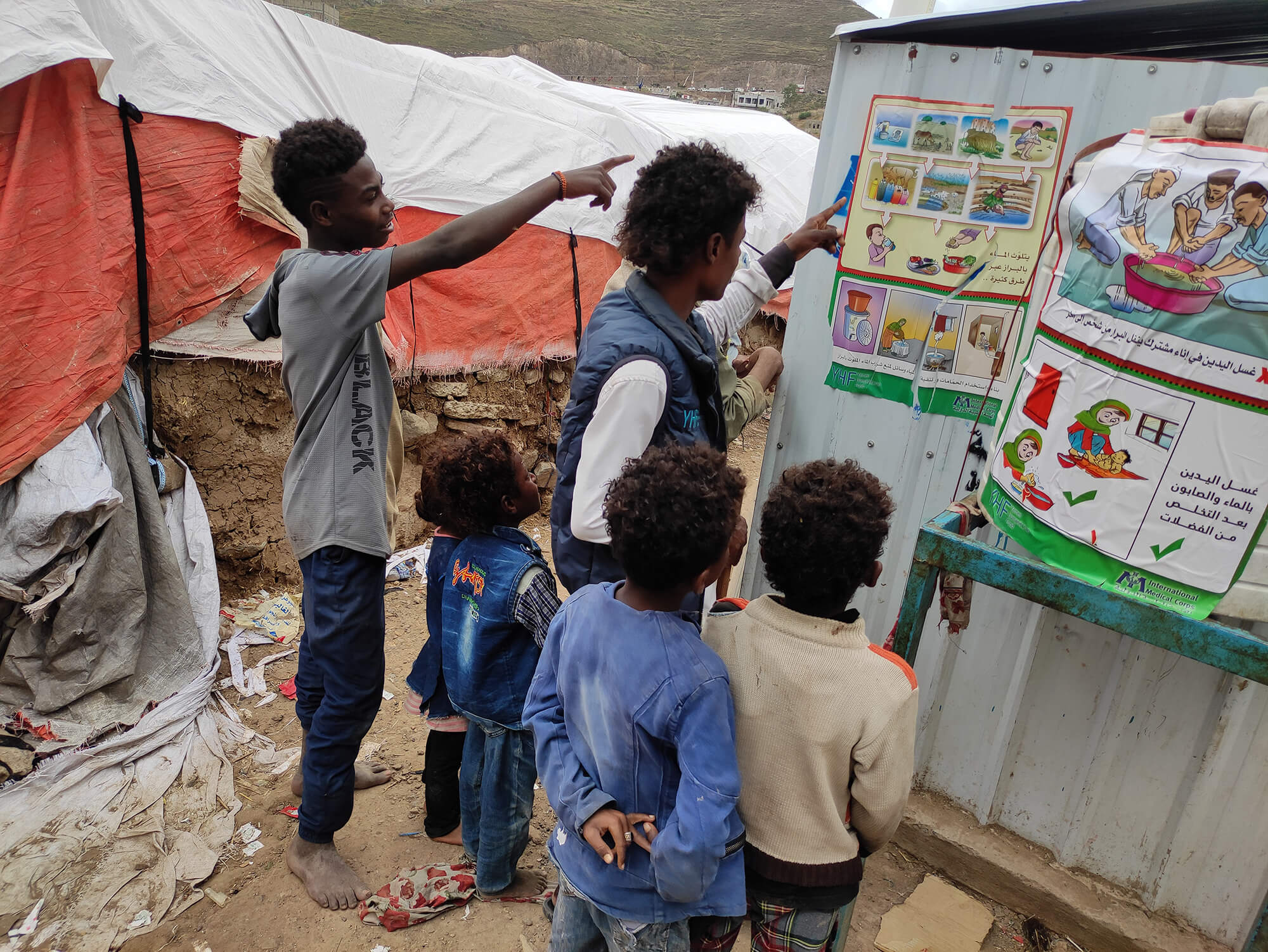 Basheer educates children in Authority Road IDP Camp on the importance of good hygiene.