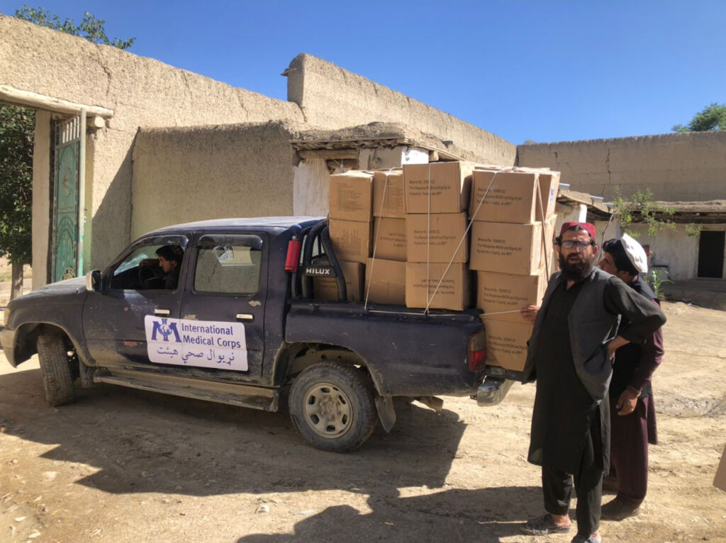 Our team loads hygiene kits to distribute to villagers in Gayan district after the earthquake.