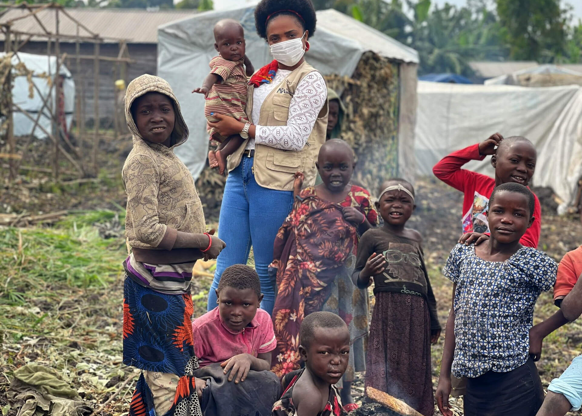 Asha Kisitu plays with children in Mujoga camp.