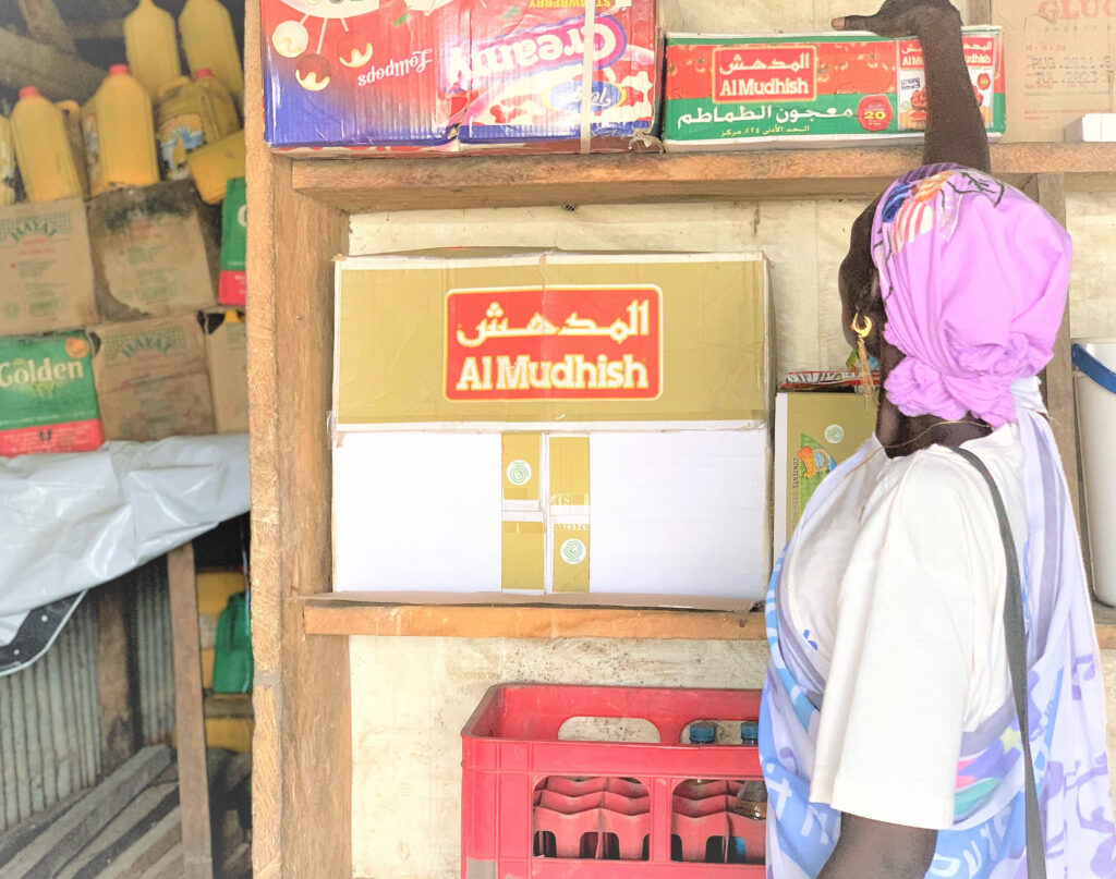 Rebecca Aluel Bul arranges some of the goods in her shop in Panyagor, South Sudan.