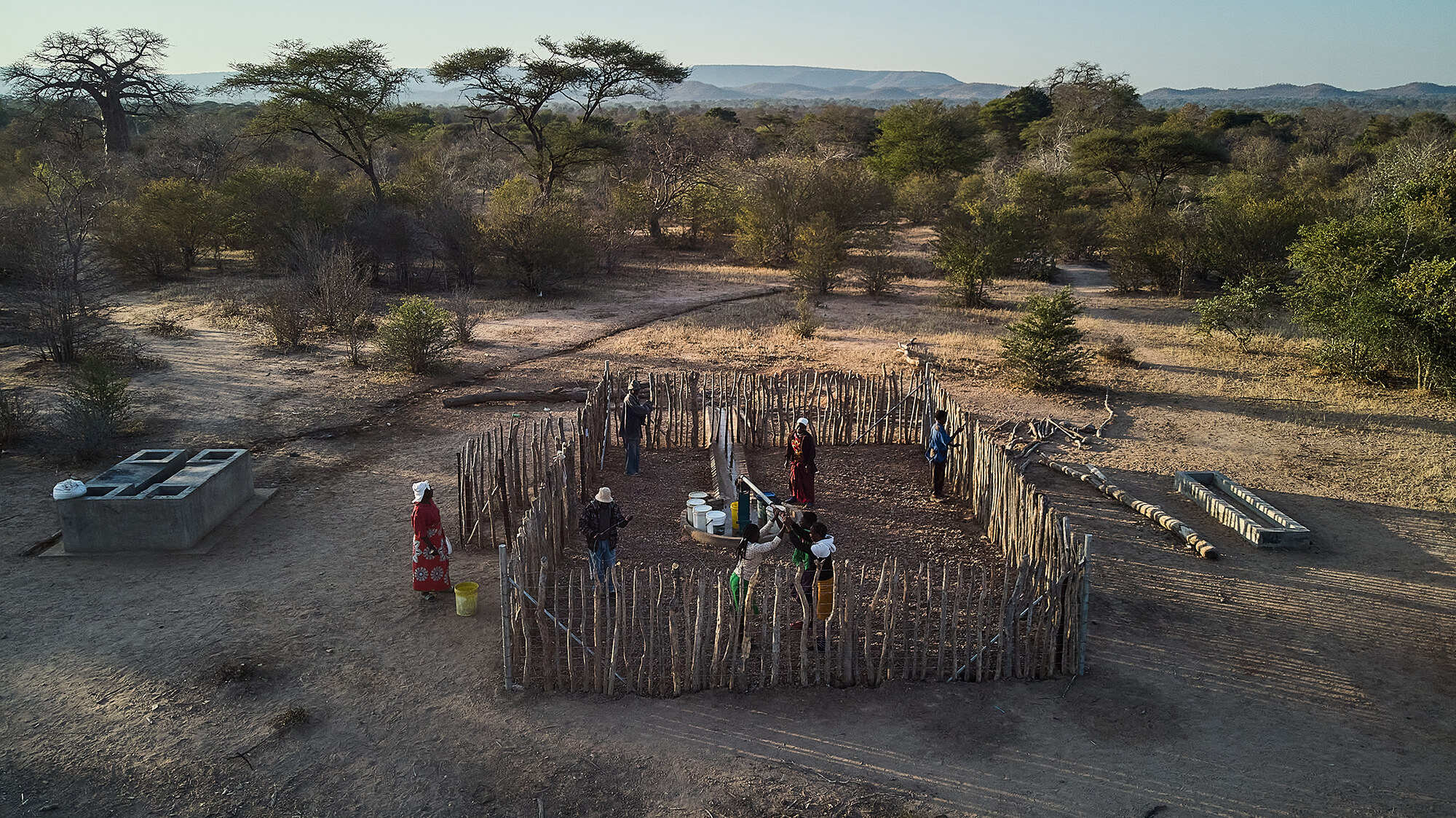 Villagers in Siangwemu pump for water. International Medical Corps repaired the pump, which had been dysfunctional for several years.