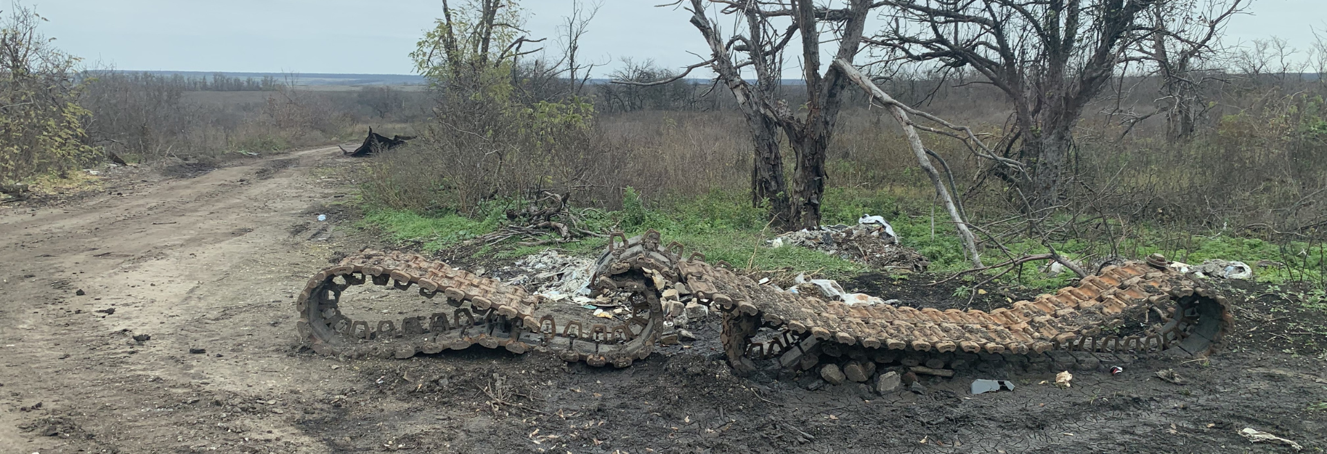 The remains of a destroyed tank lay on the roadside in Dovgenke, a village in Izyum district.