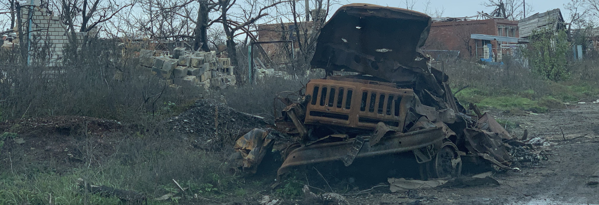 Roads that were once lined with trees in Dovgenke village now contain the remains of military trucks destroyed in battle.