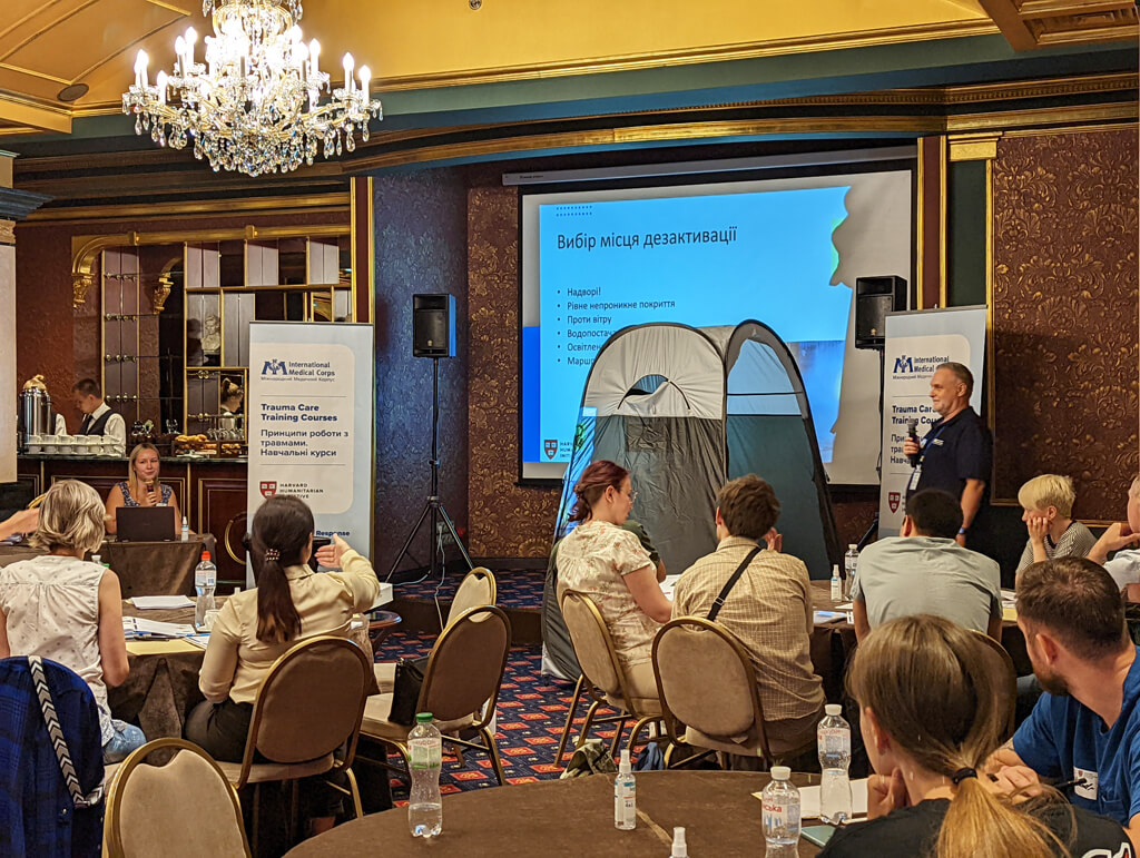 Dr. Charles Wright lectures on decontamination during a CBRNE training session. We set up decontamination stations to help participants practice real-life CBRNE scenarios.