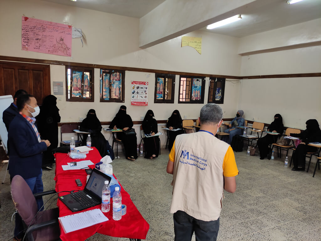 Community health volunteers learn about personal health and environmental hygiene during a training session in Ta’iziyah district.