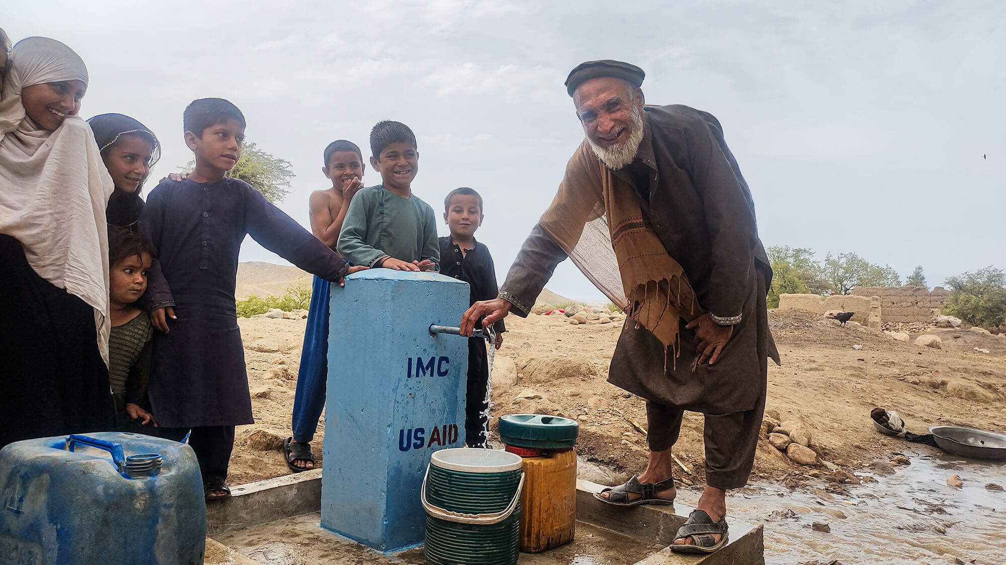 Jamil at the water point in Hujom, Afghanistan