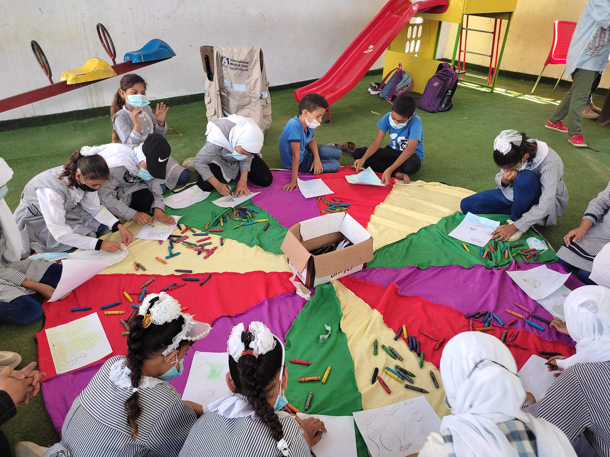 GAZA_Children-are-participating-in-PSS-session-supporting-them-to-express-their-feeling-through-drawing-activity.