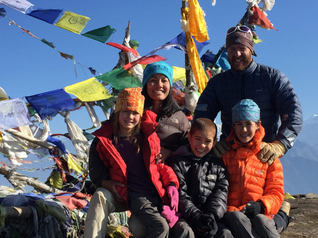 Dr. Michael Karch stands next to his wife, Dr. Kim Escudero, and their children on a trip in 2016 to Nepal, where they helped rebuild a school in the Lower Everest region.