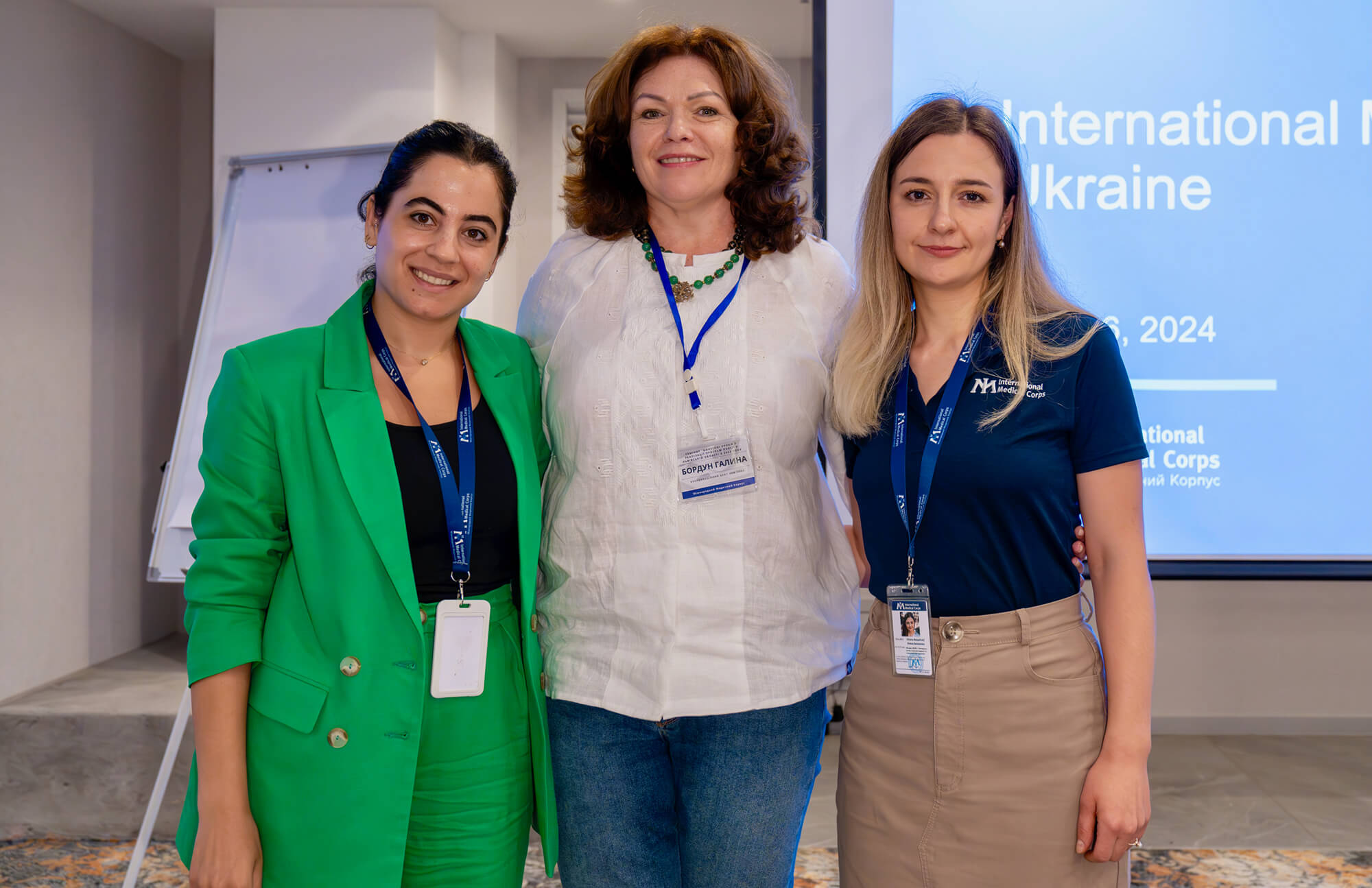 MHPSS Specialist Zeinab Ajami, left, poses with Halyna Gordon, center, from the Coordination Center for Civilian Support at the Lviv Regional Administration, with International Medical Corps colleague Uliana Bezpaliuk.