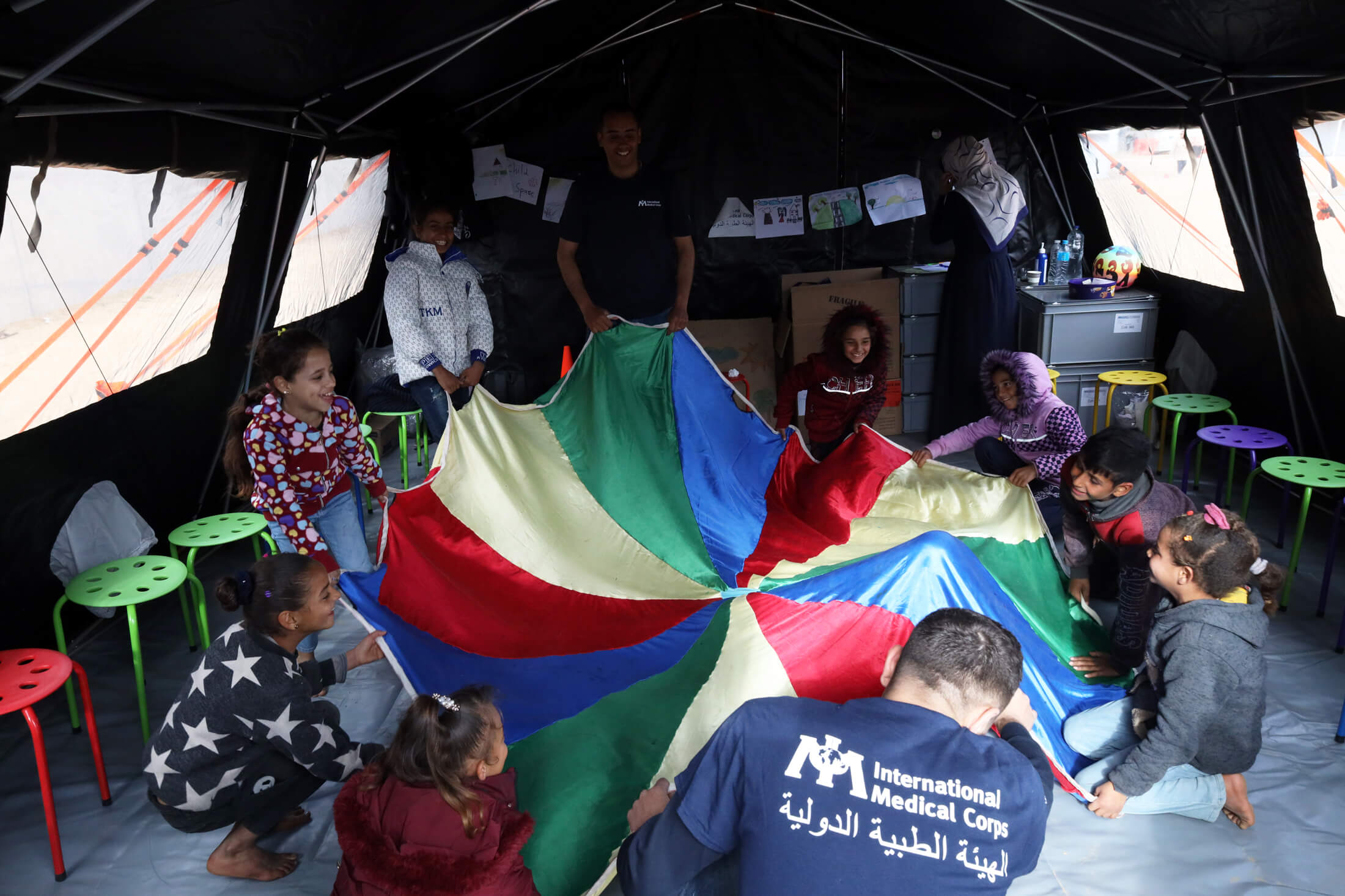 Child Protection specialists lead a play session at International Medical Corps’ field hospital.