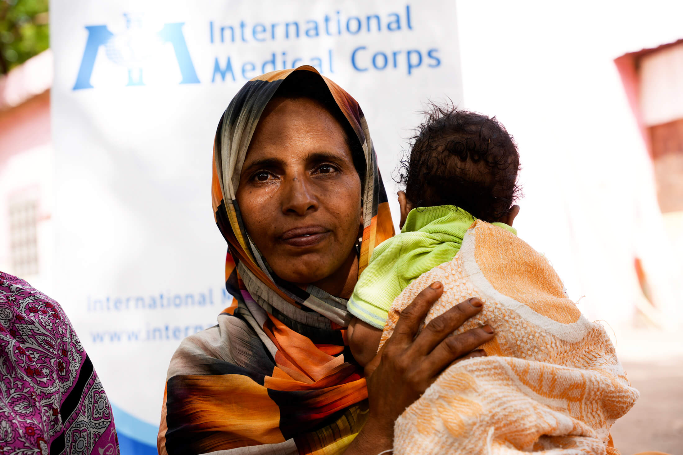 Abda Ismael, 38, holds her nine-month-old son, Mustafa. Abda joined the group to form connections with other women in her community, and learn about infant and young-child feeding practices for her children in this time of war.