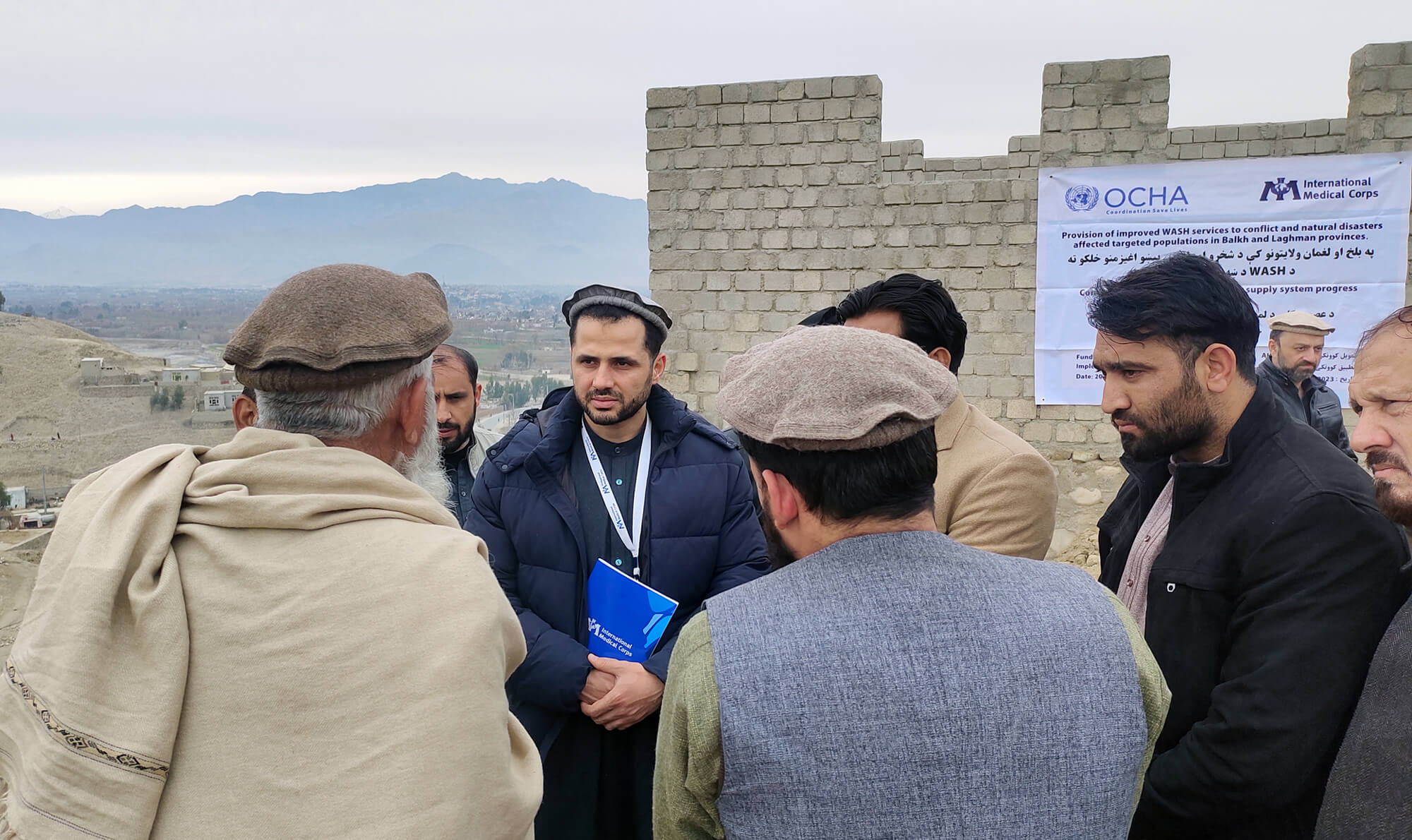 Ahmed Kassas (center) meets with engineers in charge of building a water supply system on behalf of International Medical Corps.