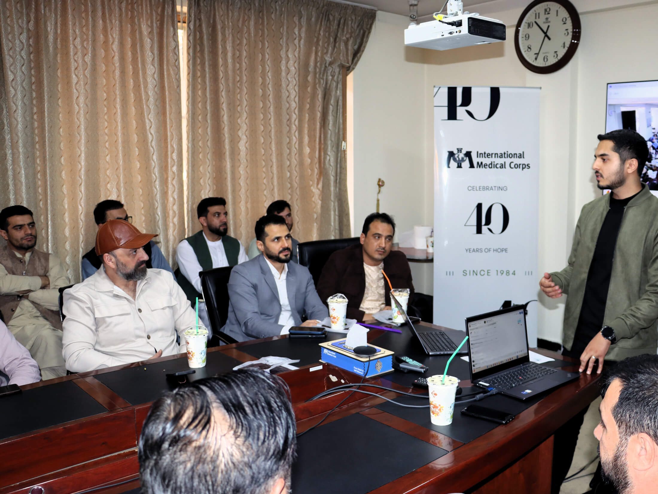 M. Maseeh Shams, Communications Manager, addresses his colleagues at the 40th anniversary event in Kabul.