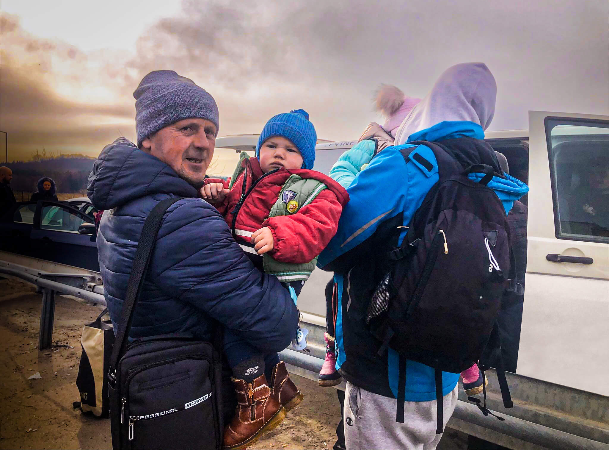 A Ukrainian refugee family crosses the border into Poland on March 1, 2022.