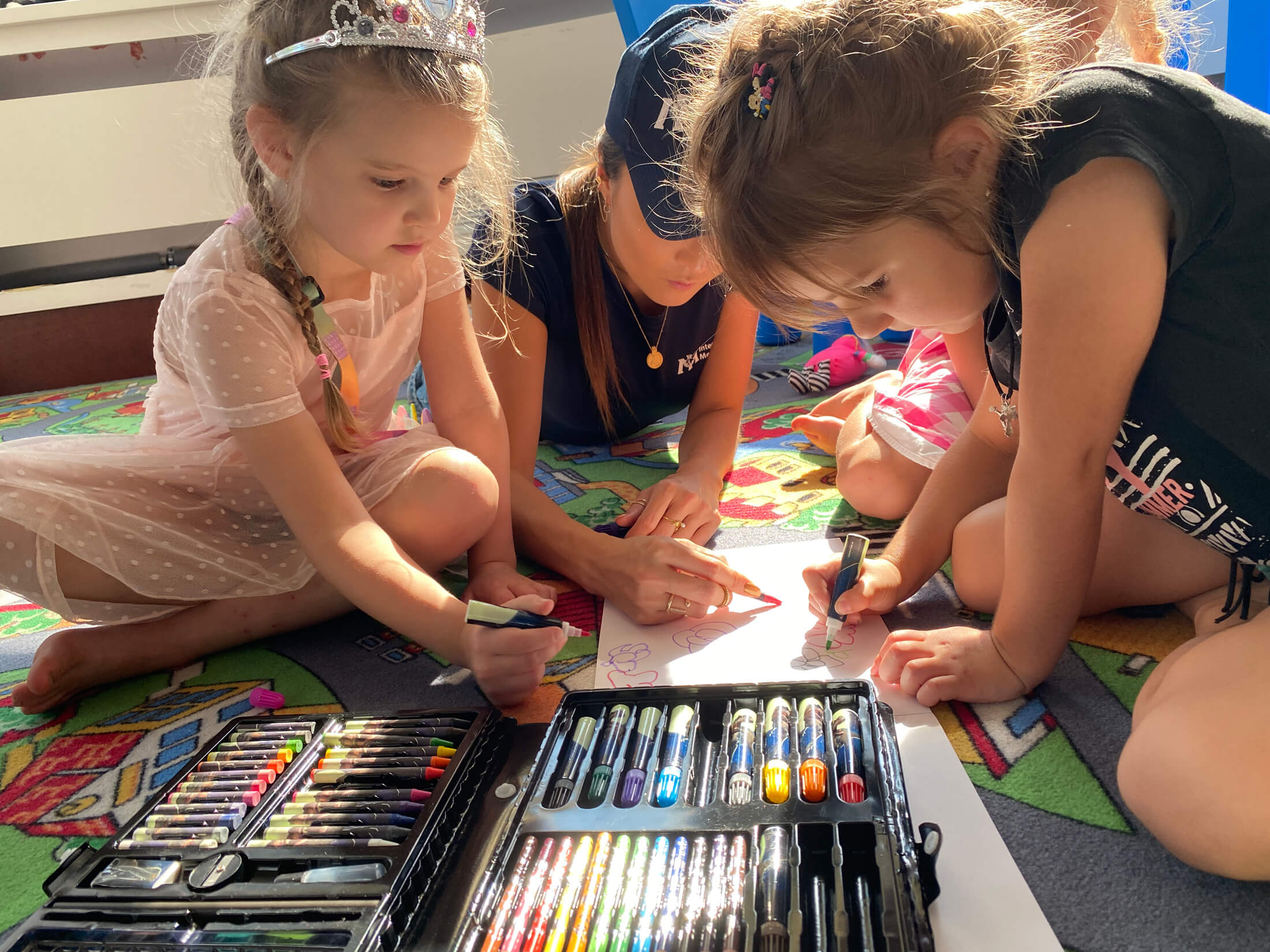 International Medical Corps Global Ambassador Ashley Park plays with children at a refugee centre in Warsaw.