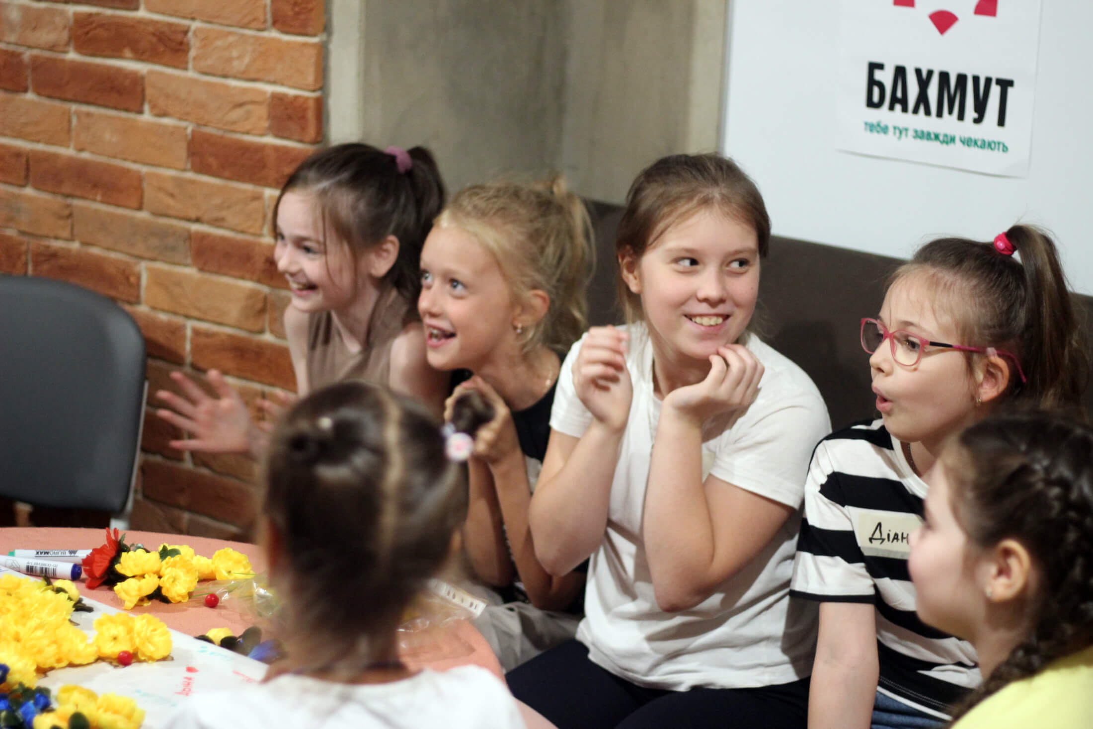 Children enjoy art projects and games during a psychosocial support session at the “With Bakhmut in My Heart” hub.