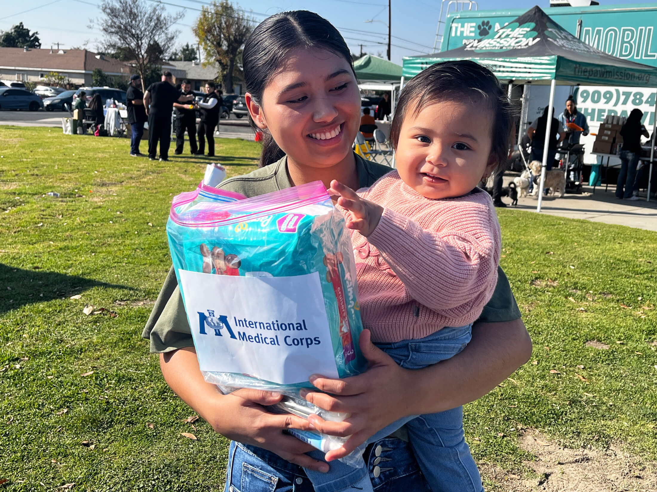 A mother and daughter from the Altadena area with hygiene supplies they received from our team.