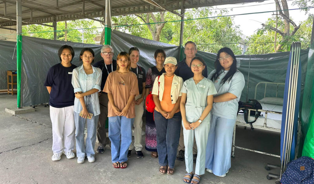 Some members of International Medical Corps’ Emergency Response Team pose with local staff at our mobile field hospital northeast of Nay Pyi Taw, Myanmar.