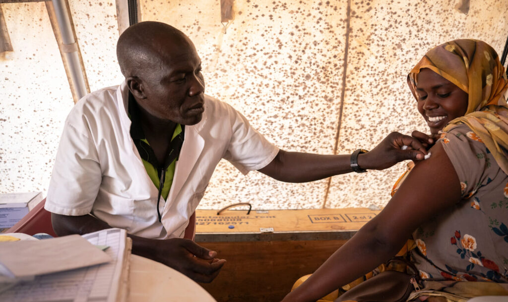 A pregnant woman receives a routine immunization at our clinic in Dougui camp.
