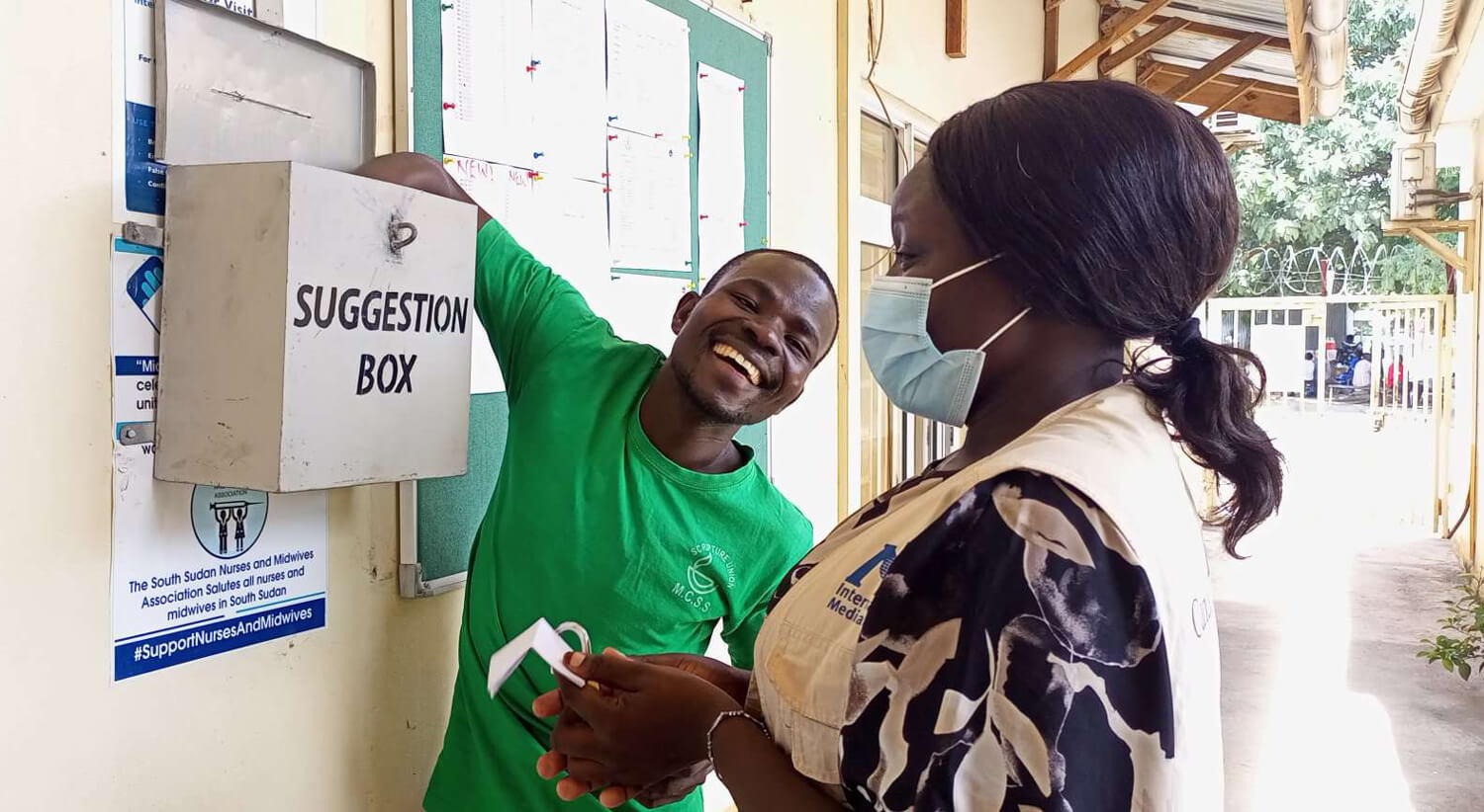 Staff gather feedback from a suggestion box at a teaching hospital in Malakal, South Sudan.