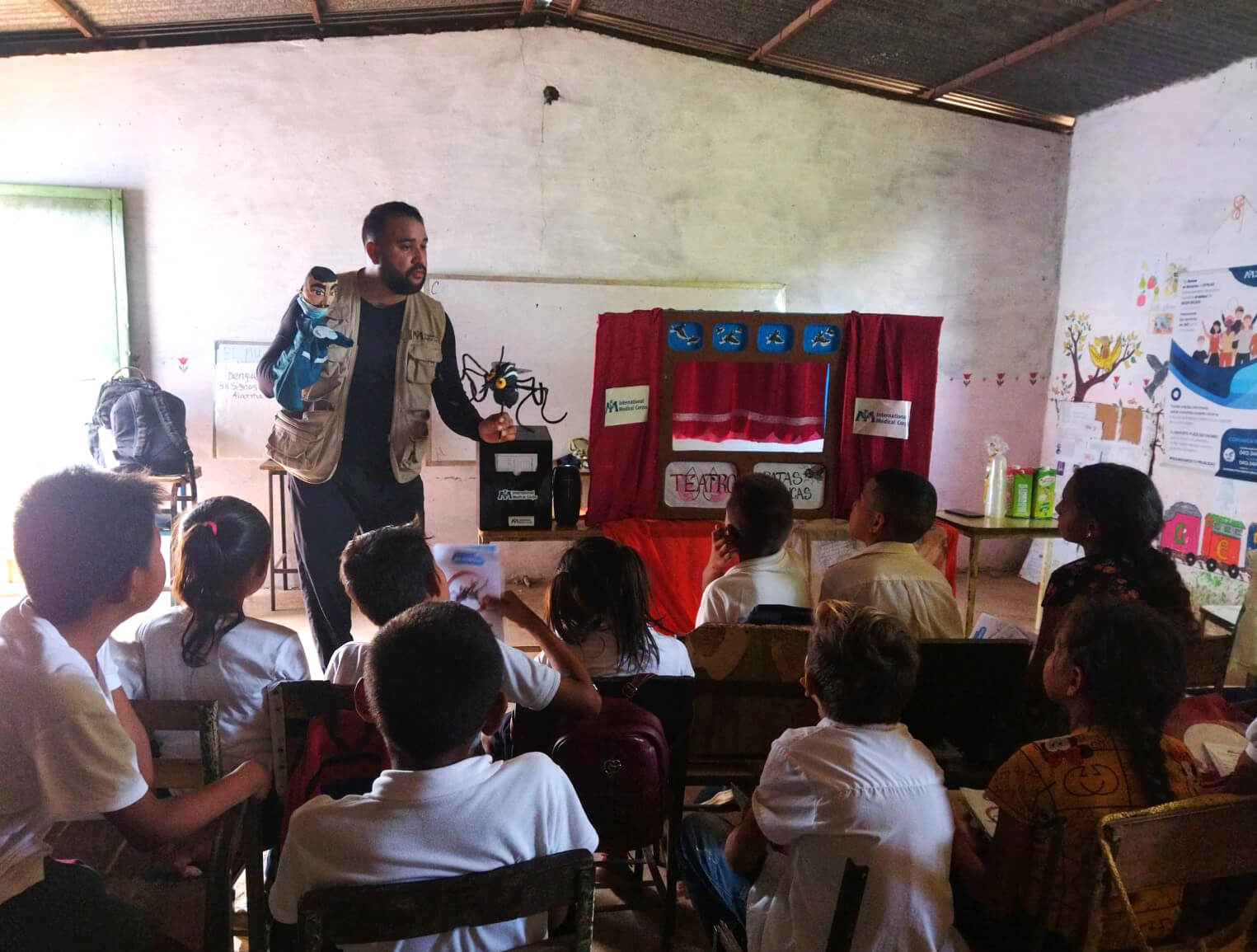 International Medical Corps staff use puppets to conduct a dengue education session at a school in Bolivar state, Venezuela.