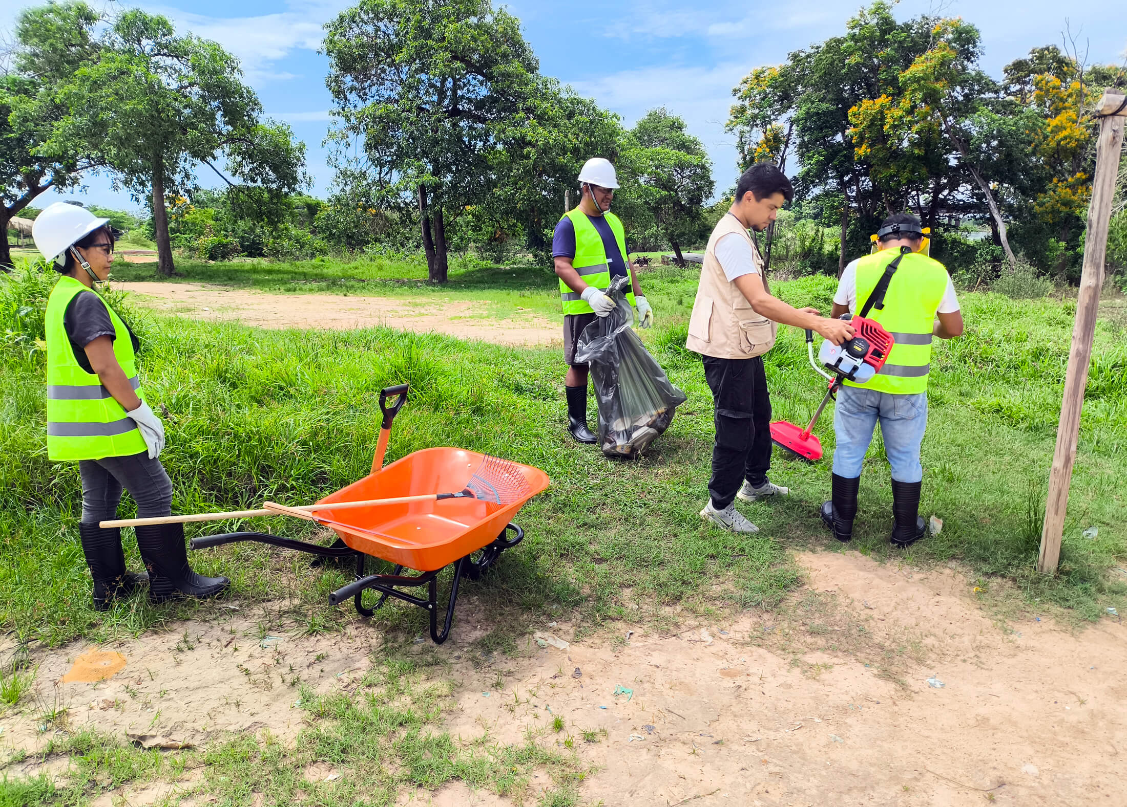 International Medical Corps staff members train community members on the removal of mosquito breeding sites.
