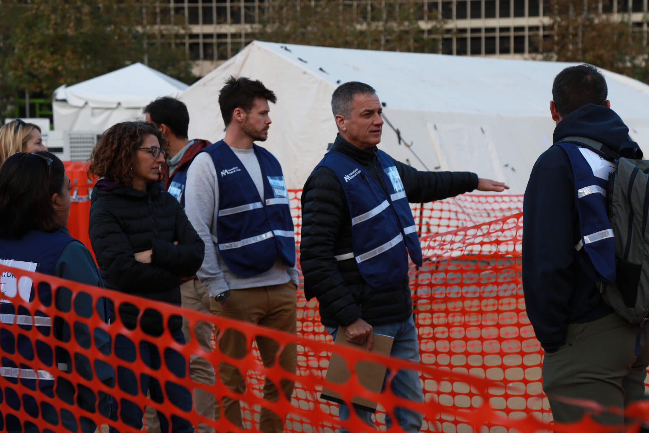 Dr. Fuller (center) helps train International Medical Corps staff members and volunteers during an emergency field hospital simulation in 2018.