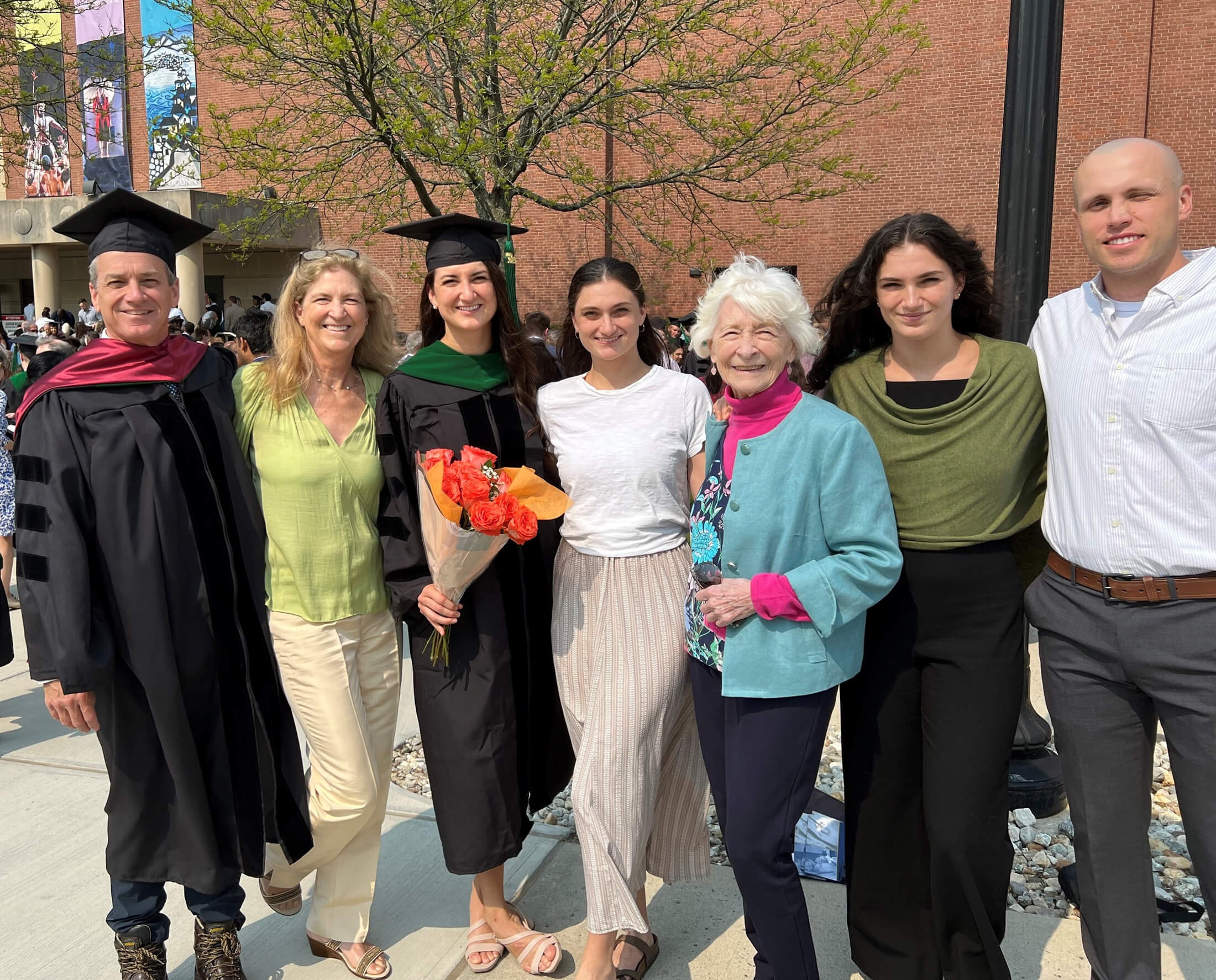 Dr. Fuller stands with his family at an academic event in Connecticut.