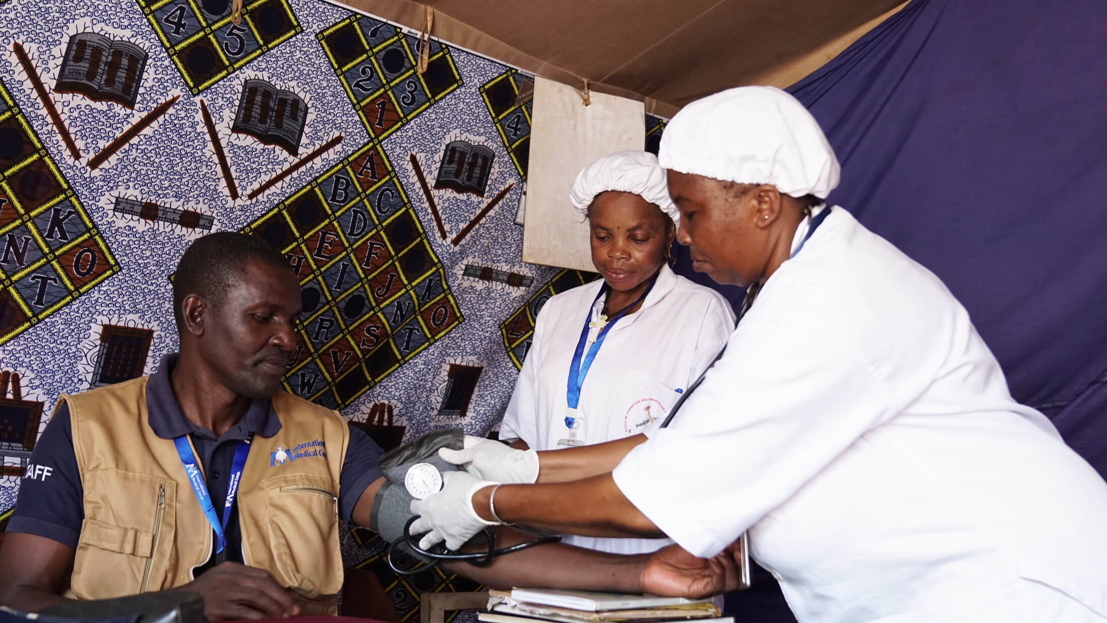 Trainees practice clinical skills in a clinic at a camp for displaced people in Bria.