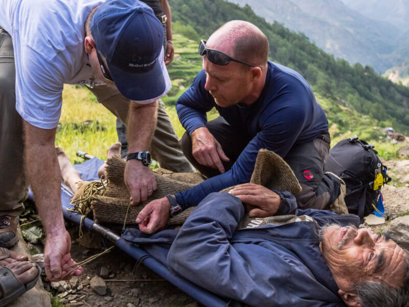 First responders treat a man on a stretcher during our response to the Nepal earthquake in 2015.