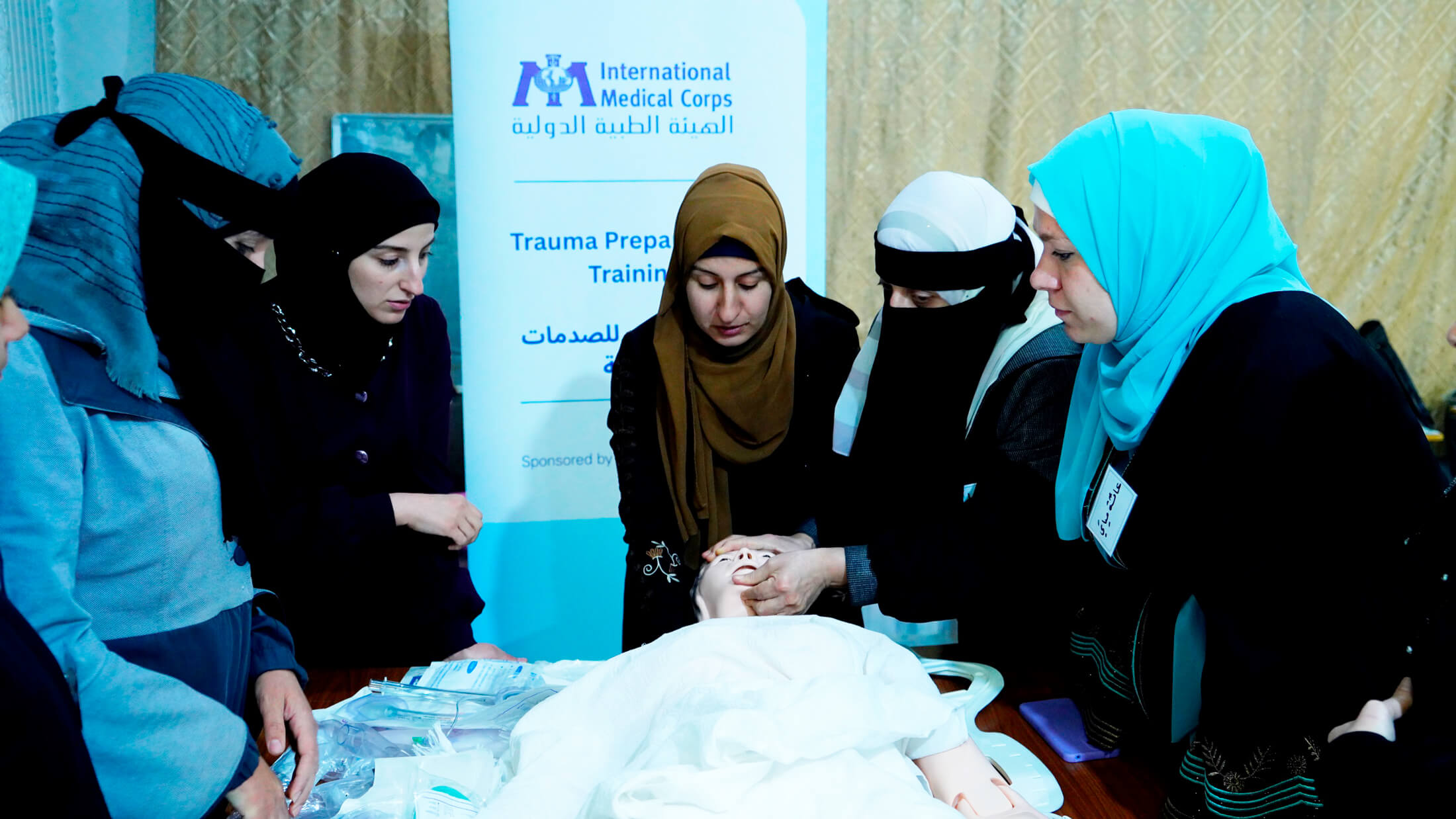 Participants learn how to administer lifesaving aid during a trauma preparedness training in Idlib, Syria.