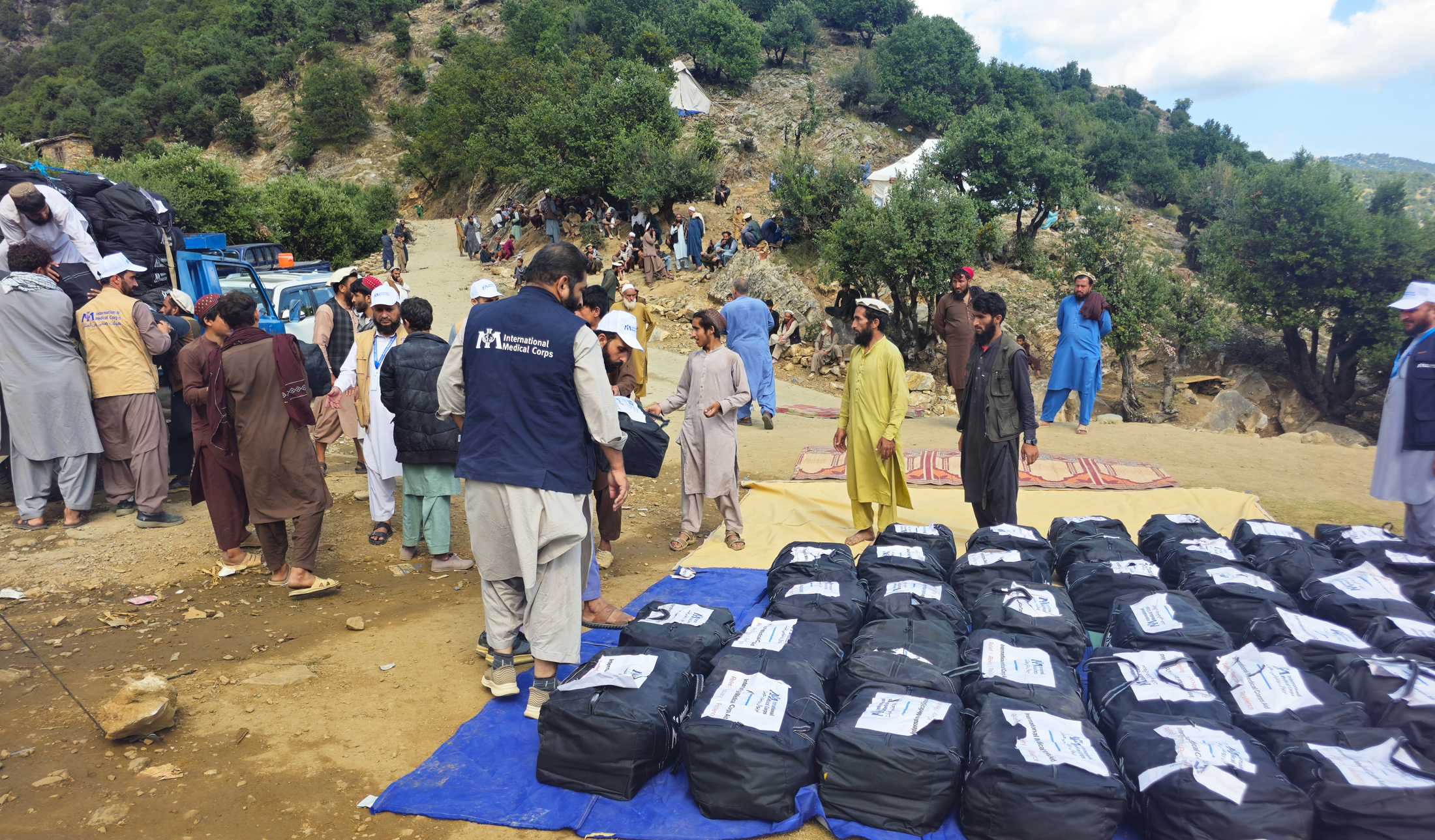 Staff members distribute winterisation kits and clean drinking water to earthquake-affected communities in Kunar province.