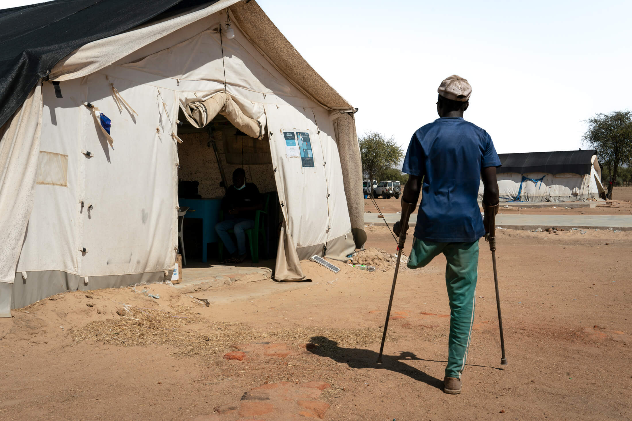 Aziber Asadiq Mohamed, on his way to the International Medical Corps pharmacy at Dougui camp.