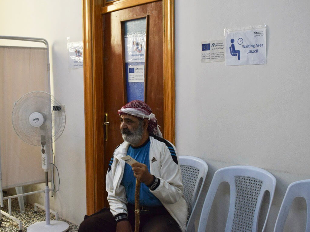 A patient waits to be examined.