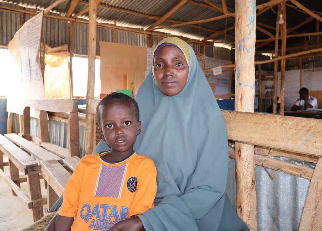 Habiba Ibrahim sits with her son Mohammed Ali at International Medical Corps’ health facility in Bokolmayo Refugee Camp, where our team diagnoses malnutrition and provides treatment, therapeutic food and education sessions.