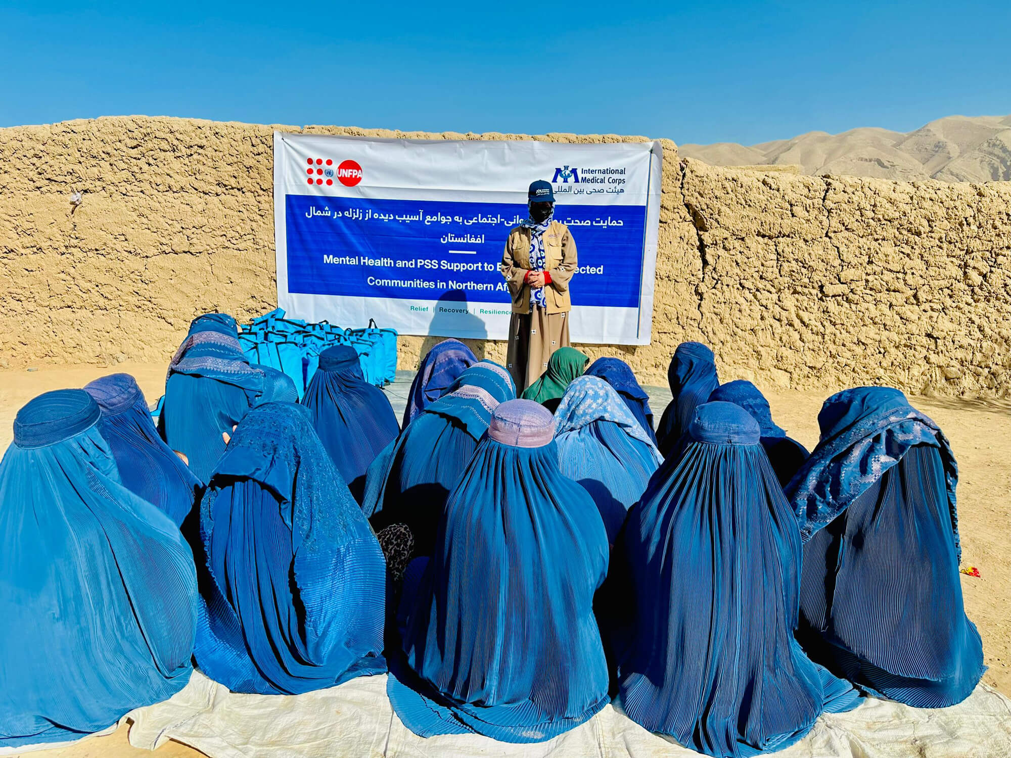 A staff member conducts an awareness-raising session in Samangan province for women affected by the earthquake.