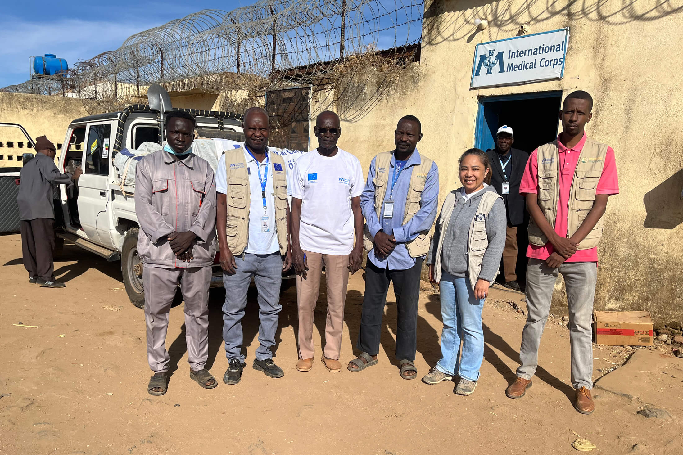 Dr. Bernardita Gaspar (second from right) meets with International Medical Corps staff members before they embark on a journey to deliver critically needed medical supplies to clinics in Tawila.