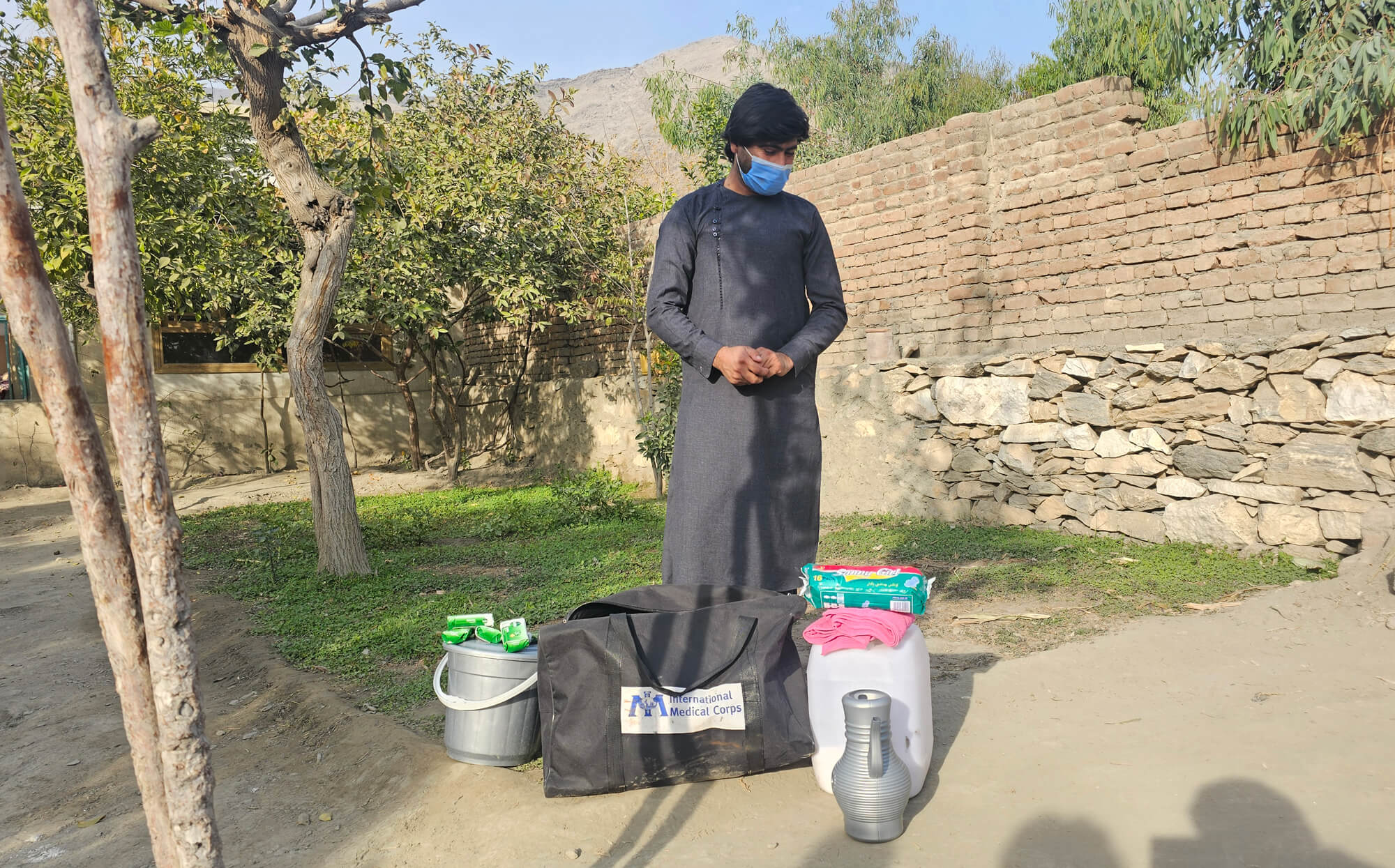 Farid receives his hygiene kit from International Medical Corps.