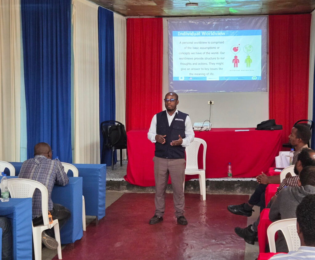An MHPSS team member delivers basic psychosocial skills training to 30 frontline healthcare workers.