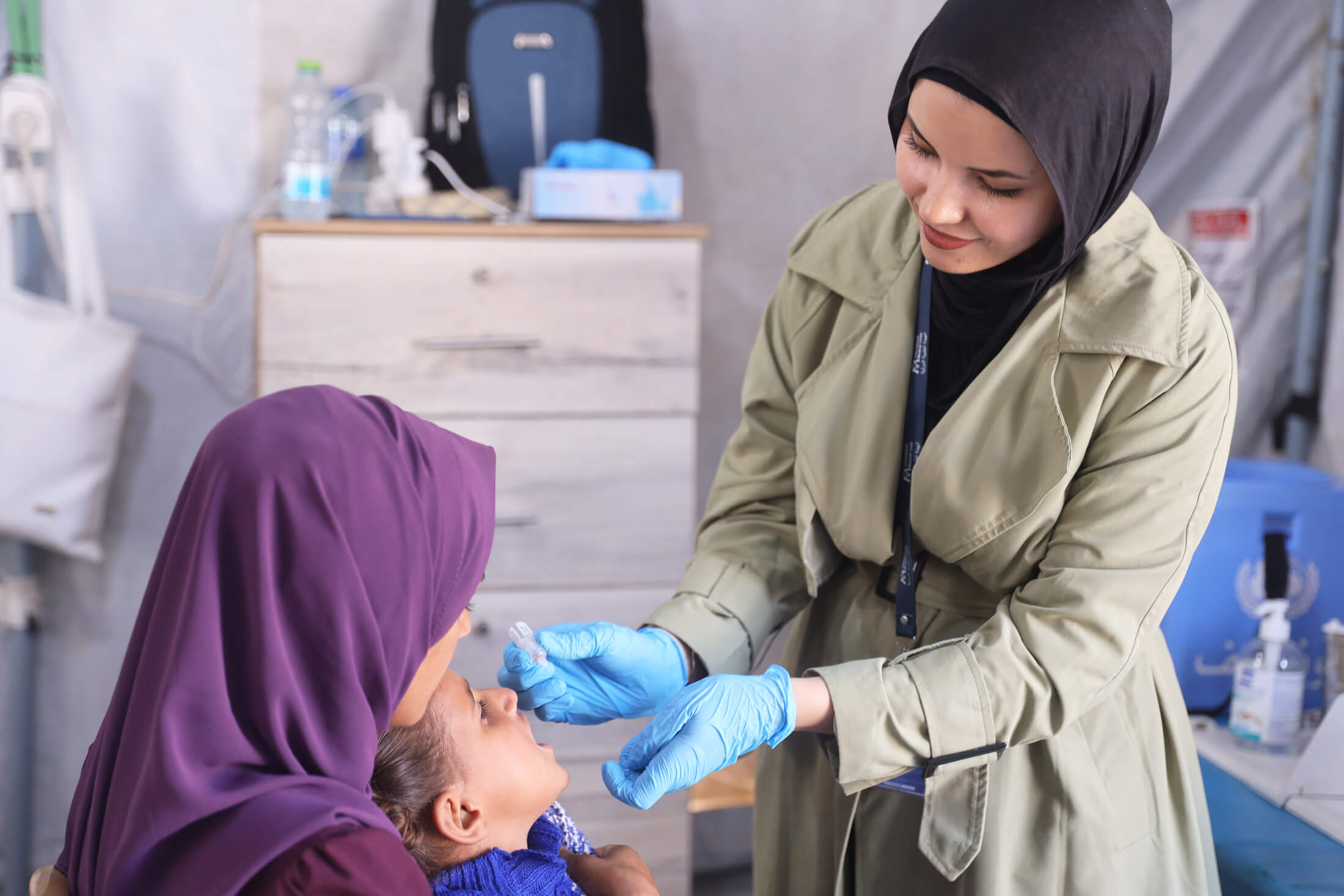 A nurse administers tuberculosis vaccine to a child.